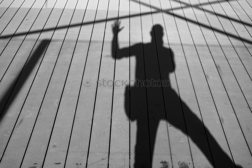 Similar – Schatten von Frau mit Tasche auf Stein