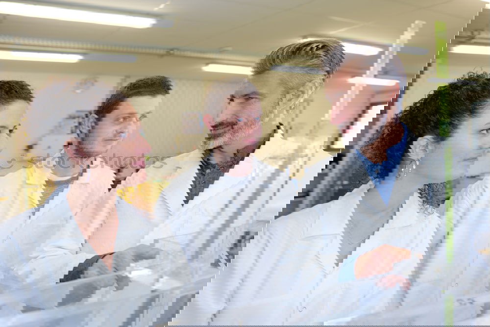 Similar – Image, Stock Photo Workers communicating in lab