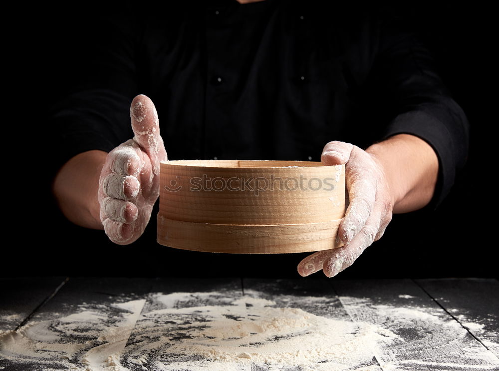 Similar – round wooden sieve in male hands