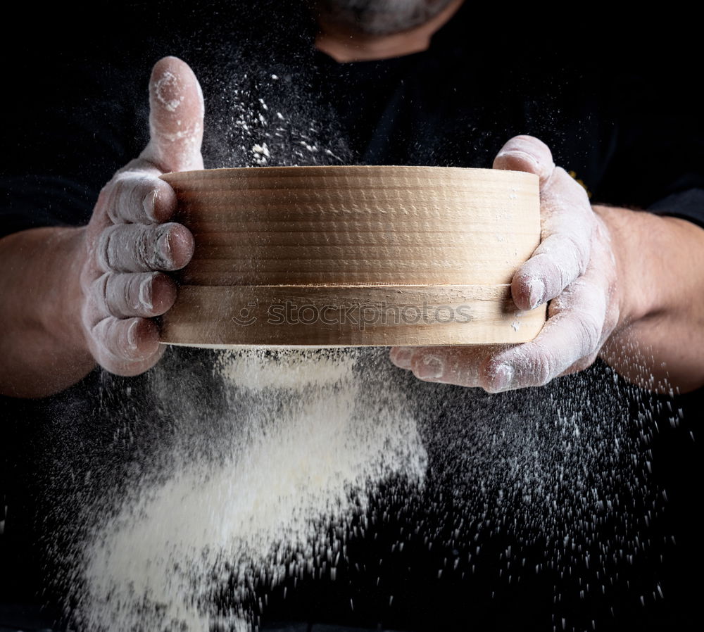 Similar – round wooden sieve in male hands