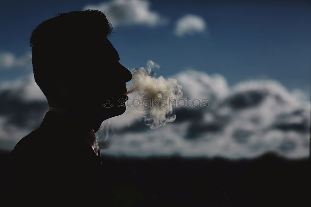 Similar – Young woman smoking near window