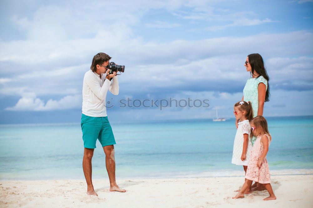 Similar – Image, Stock Photo Mother and children playing on the beach.