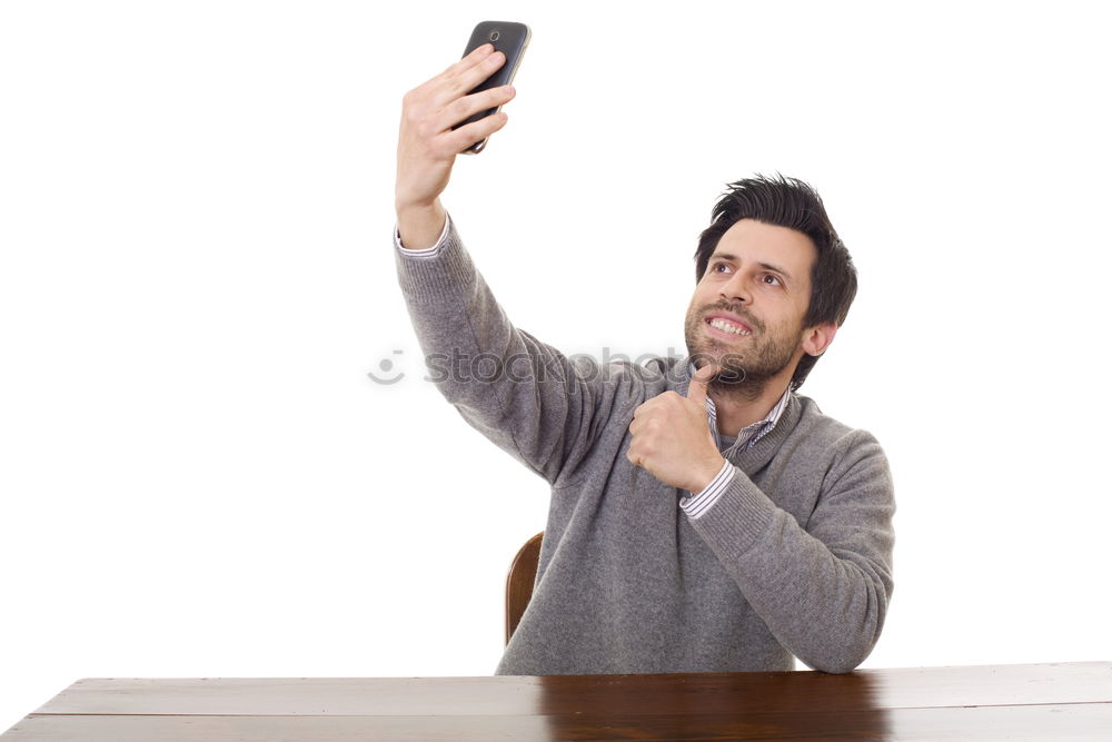 Similar – Business man with mobile phone in his hand