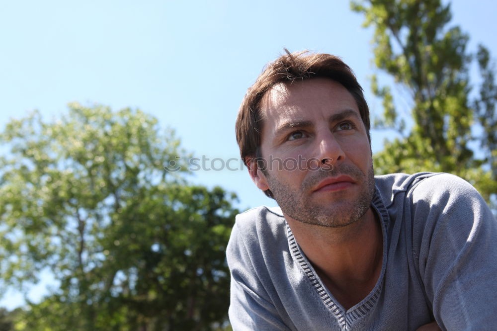 Similar – Young man posing outdoors