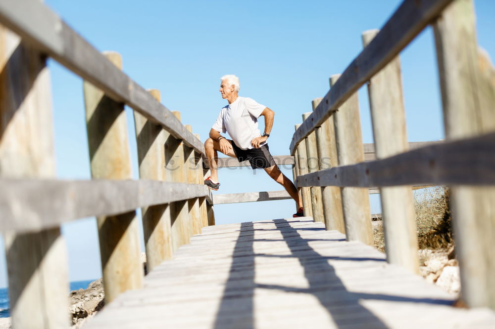 Similar – Image, Stock Photo Portrait senior man walking with his bicycle next to the sea