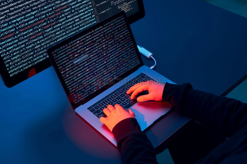 Similar – Man using computer and programming  to break code. Cyber security threat. Internet and network security. Stealing private information. Person using technology to steal password and private data