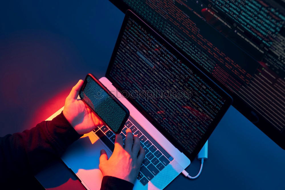 Similar – Man using computer and programming  to break code. Cyber security threat. Internet and network security. Stealing private information. Person using technology to steal password and private data