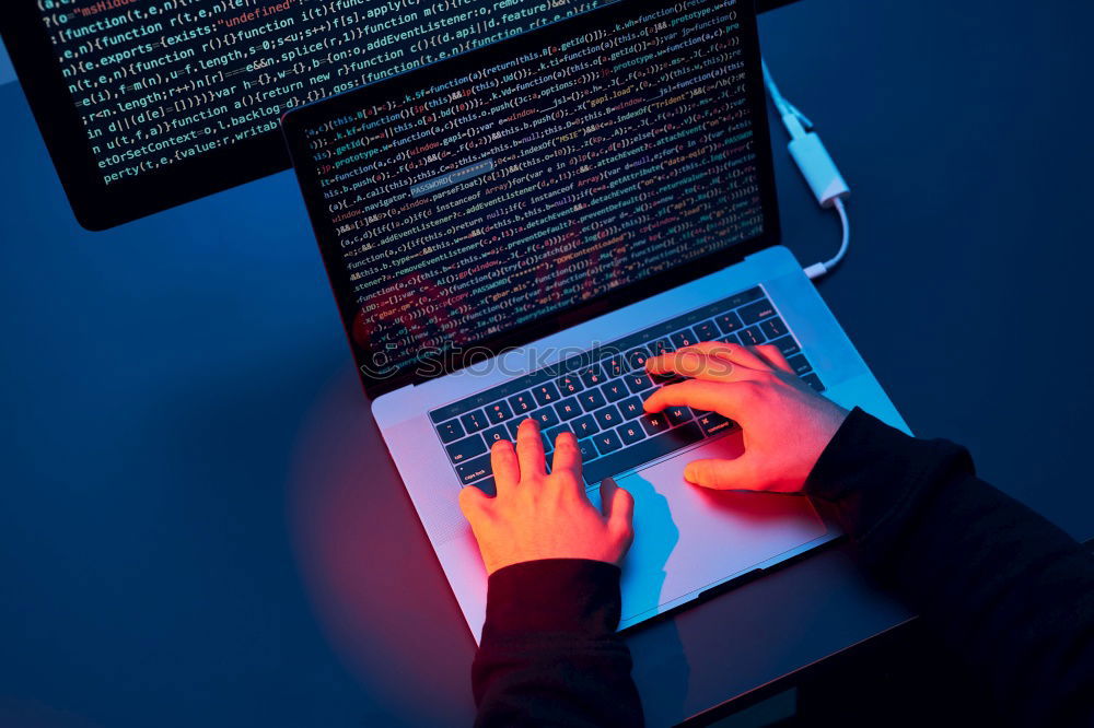 Similar – Man using computer and programming  to break code. Cyber security threat. Internet and network security. Stealing private information. Person using technology to steal password and private data