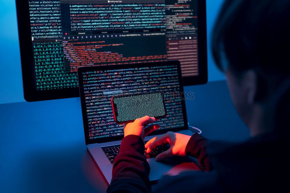 Similar – Man using computer and programming  to break code. Cyber security threat. Internet and network security. Stealing private information. Person using technology to steal password and private data