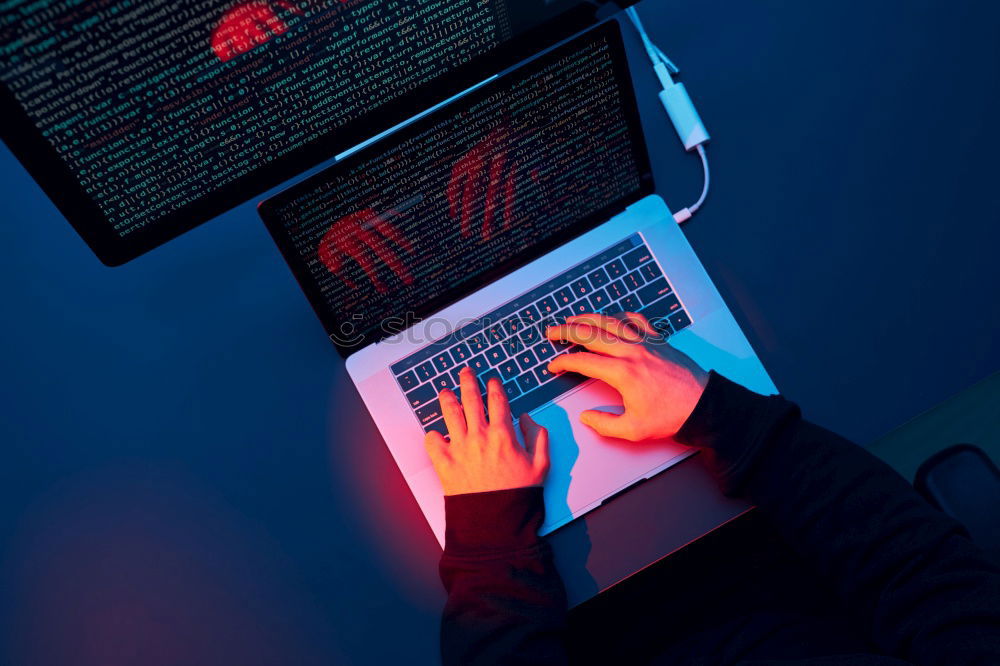 Similar – Man using computer and programming  to break code. Cyber security threat. Internet and network security. Stealing private information. Person using technology to steal password and private data