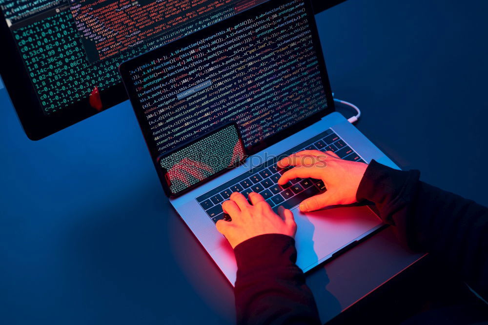 Similar – Man using computer and programming  to break code. Cyber security threat. Internet and network security. Stealing private information. Person using technology to steal password and private data