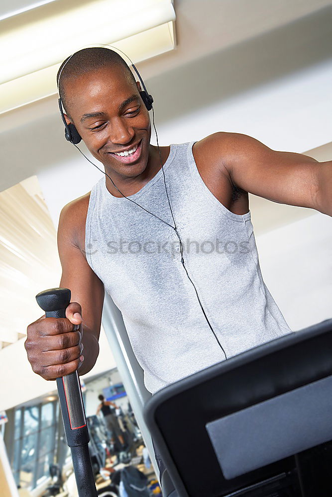 Similar – Black man running and listening to music in urban background