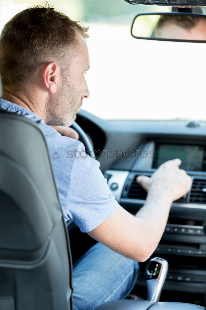 Similar – Image, Stock Photo Young man holding steering driving