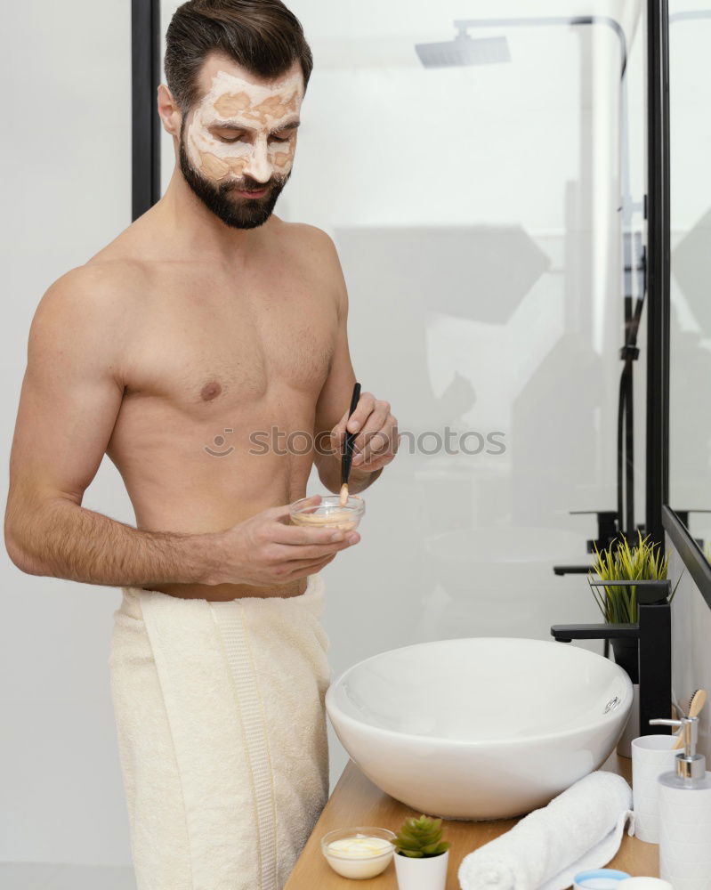 Similar – Young man applying shaving cream