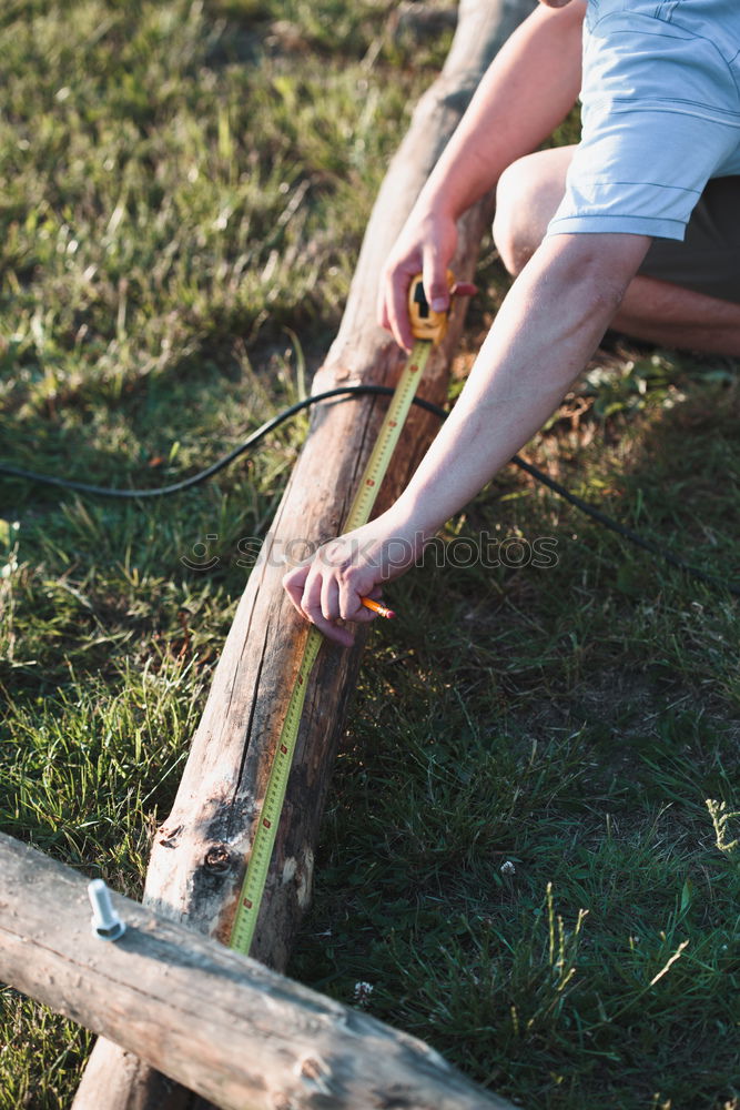 Similar – Image, Stock Photo Man drilling hole in timber while working in garden