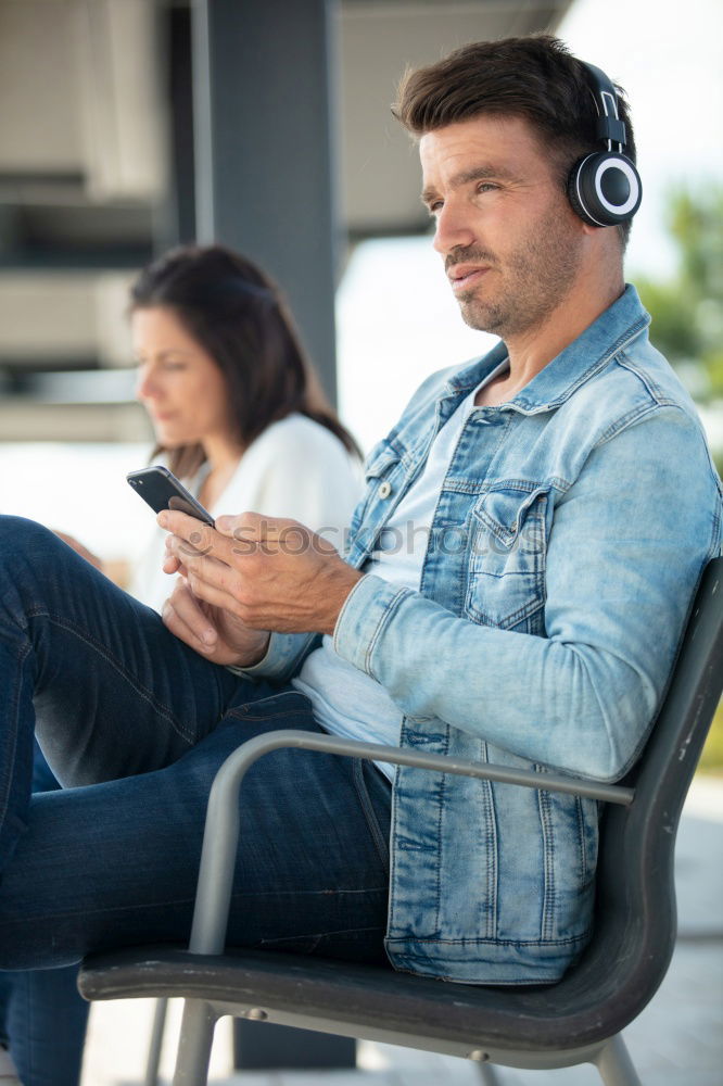 Similar – Man listening music in train