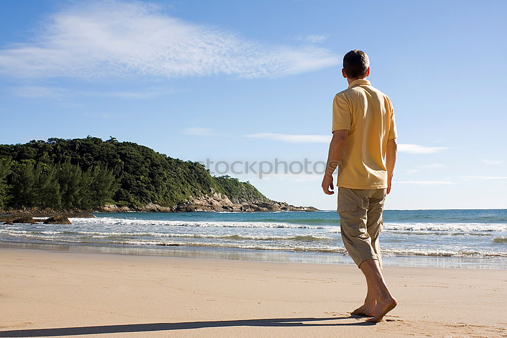 Similar – Diver in wet suit standing on beach