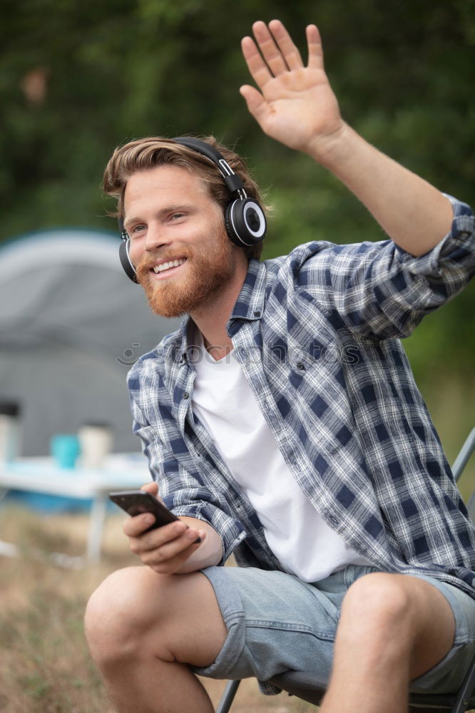 Similar – Man listening music in train