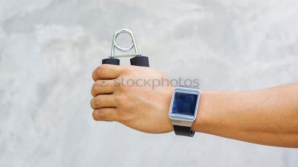 Woman using smartwatch touching touchscreen