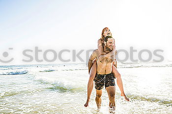 Similar – Happy best friends having good time on the beach together