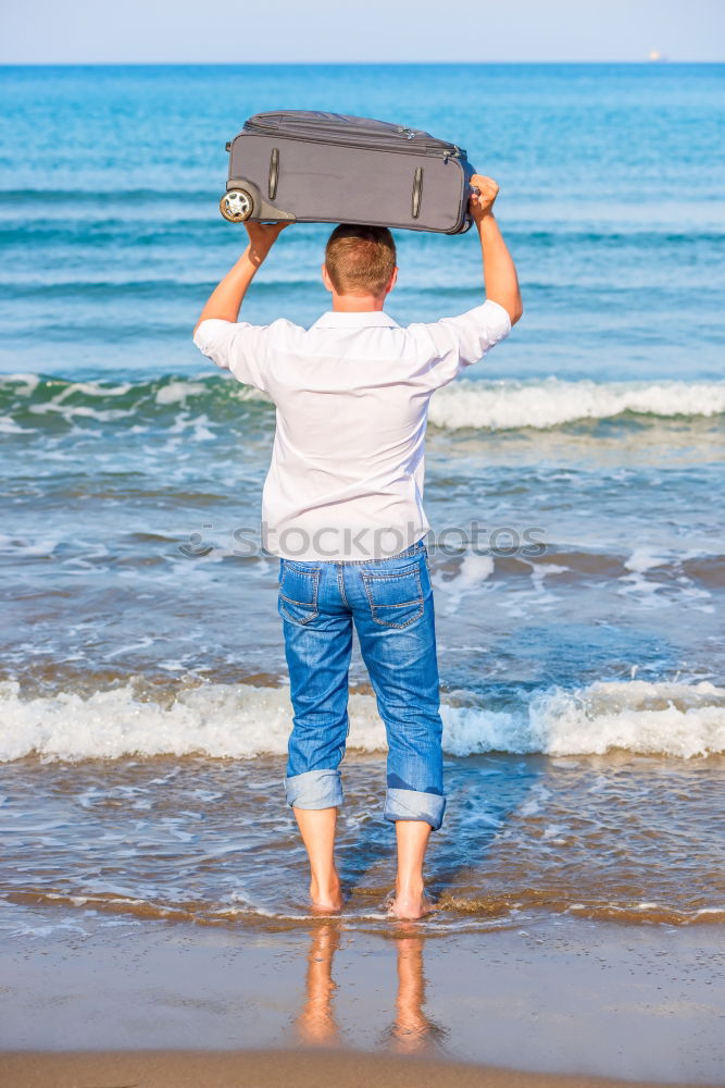 Similar – Image, Stock Photo swimmer putting on his wetsuit on the beach