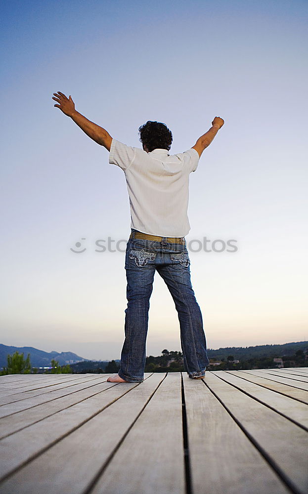 Similar – Anonymous man enjoying storm on pier