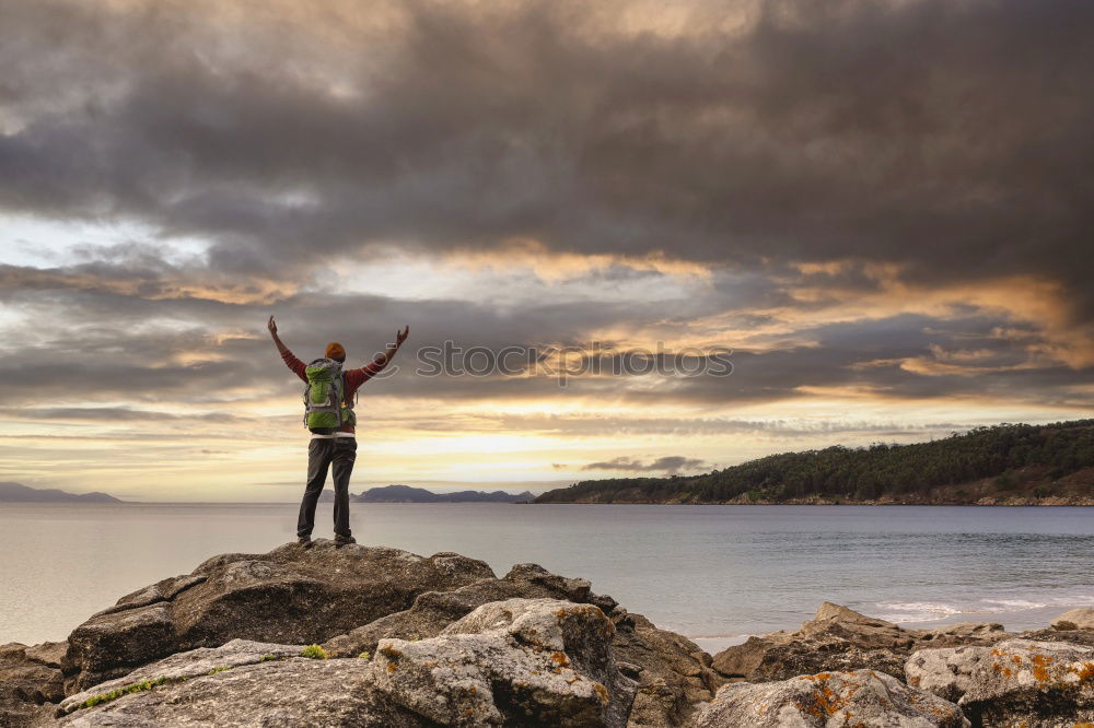 Similar – Man taking shot of island