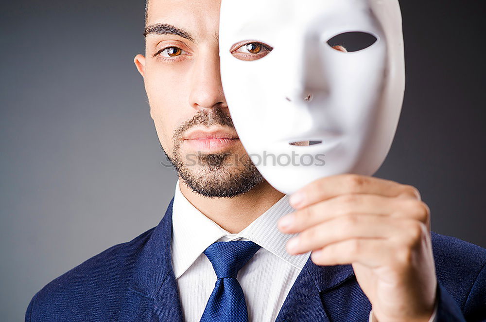 Similar – happy mature woman peeking from behind mask