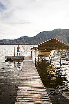 Similar – Image, Stock Photo Woman looking at hills on lake