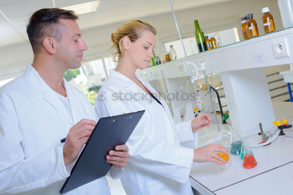 Similar – Image, Stock Photo Women standing and working in lab