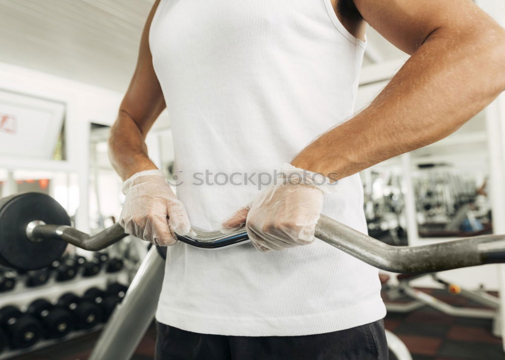 Man wrapping hands with bandages before boxing training