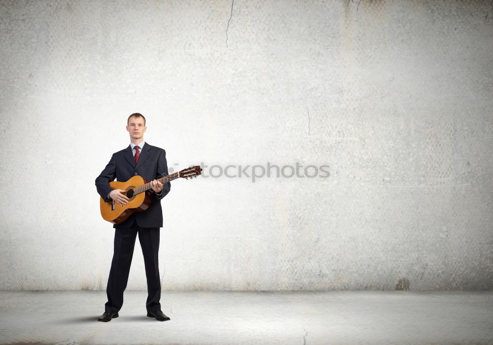 Similar – outdoor photo session with a bass player and his instruments