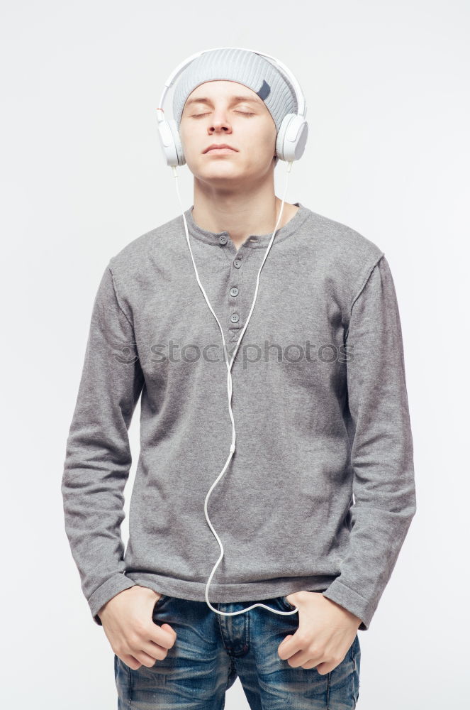 Similar – Black serious man listening to music in headphones