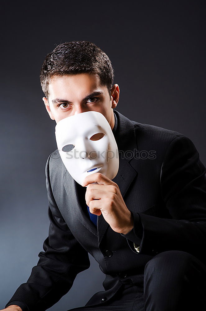 Similar – man is holding a creepy Mask