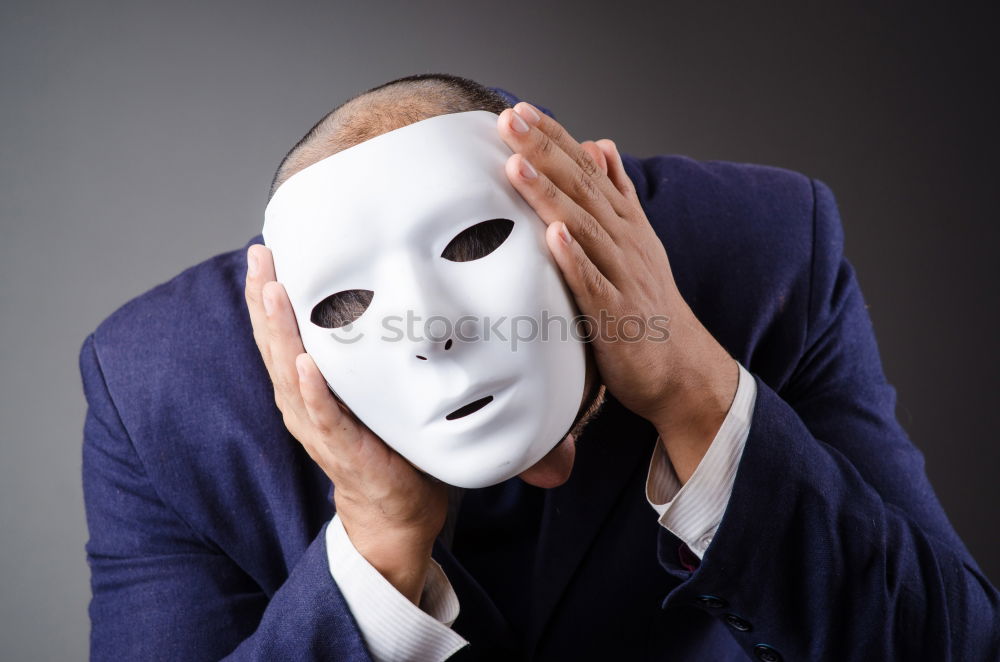 Similar – happy mature woman peeking from behind mask