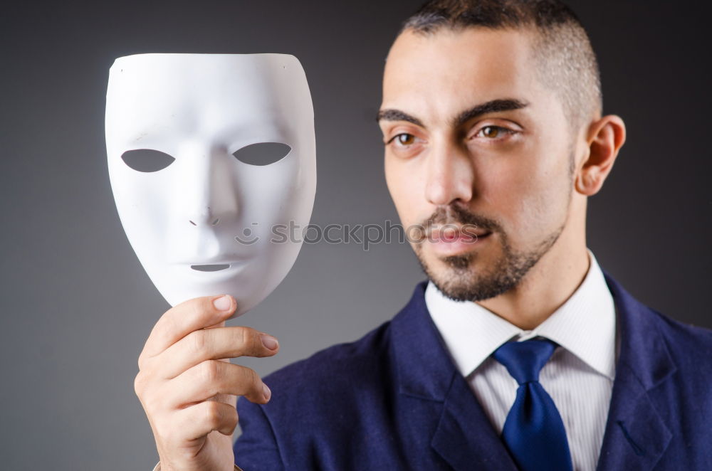 Similar – happy mature woman peeking from behind mask