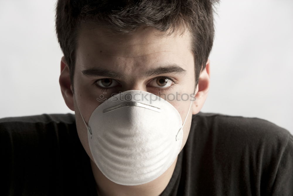 Male technician putting on goggles