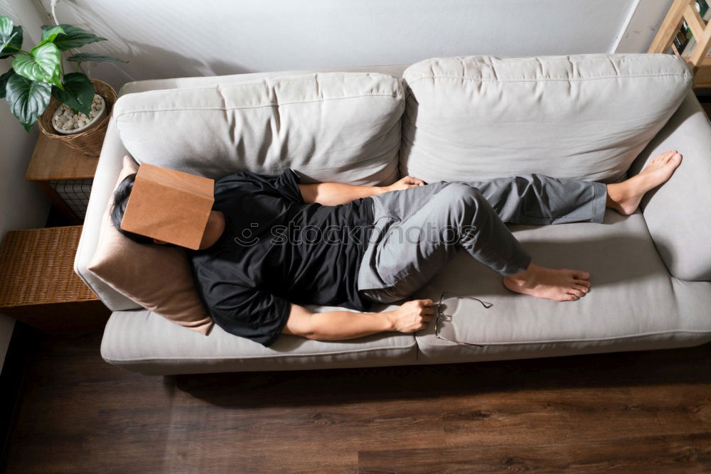 Similar – Cheerful woman lying with book