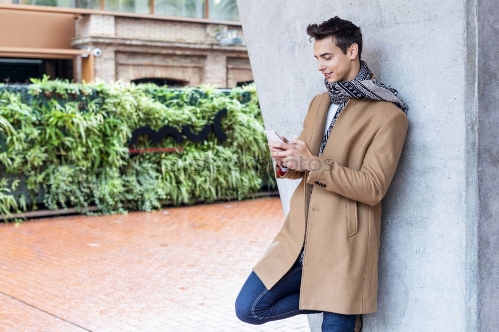 Similar – Image, Stock Photo Modern young man with mobile phone in the street.