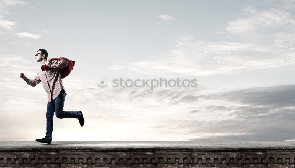 Similar – Image, Stock Photo Sportive man hanging on roof