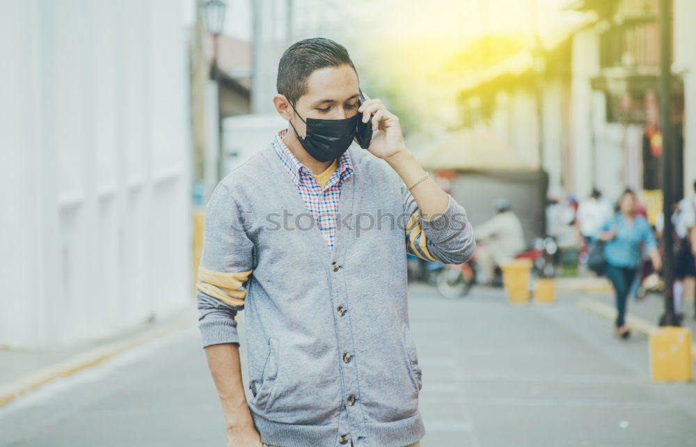 Similar – Female teenager in protective mask standing near electric scooter