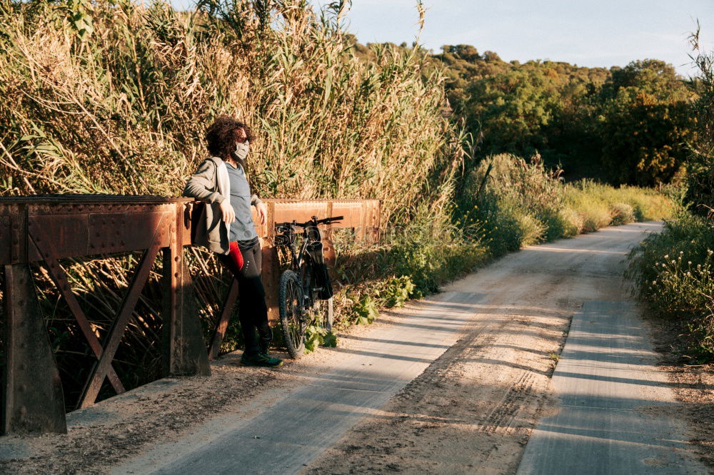 Similar – Image, Stock Photo Woman strolling on empty winter road