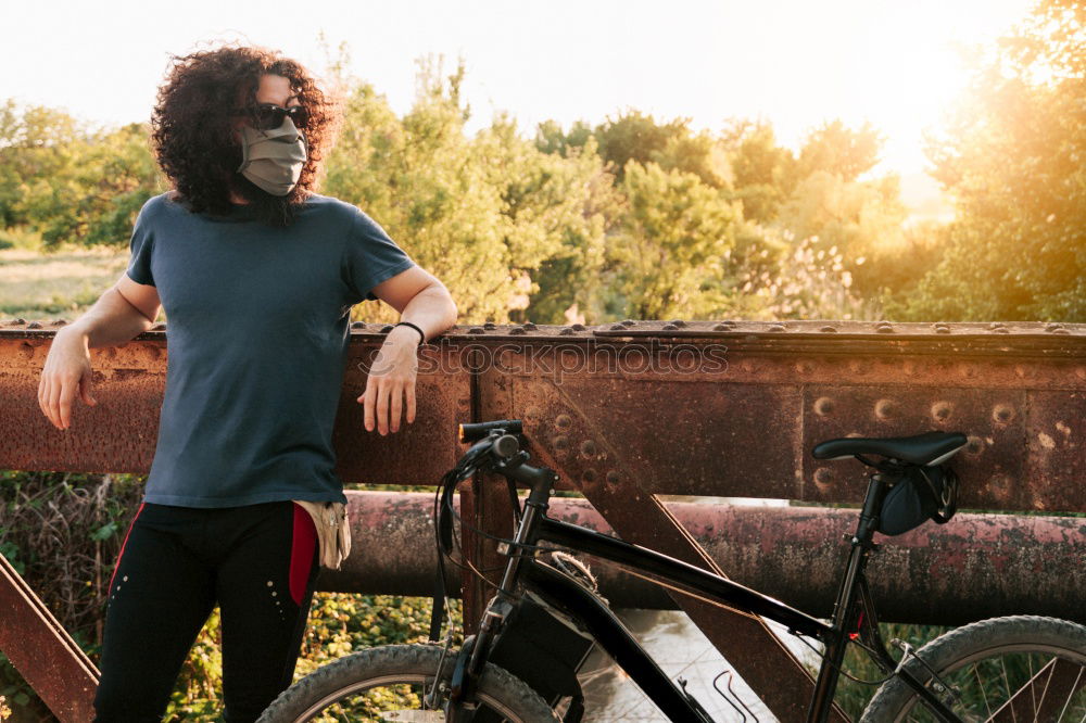 Similar – Image, Stock Photo Afro young man using mobile phone and fixed gear bicycle