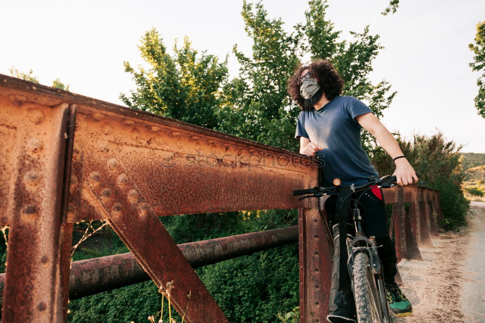 Image, Stock Photo Man walking with mountain biking