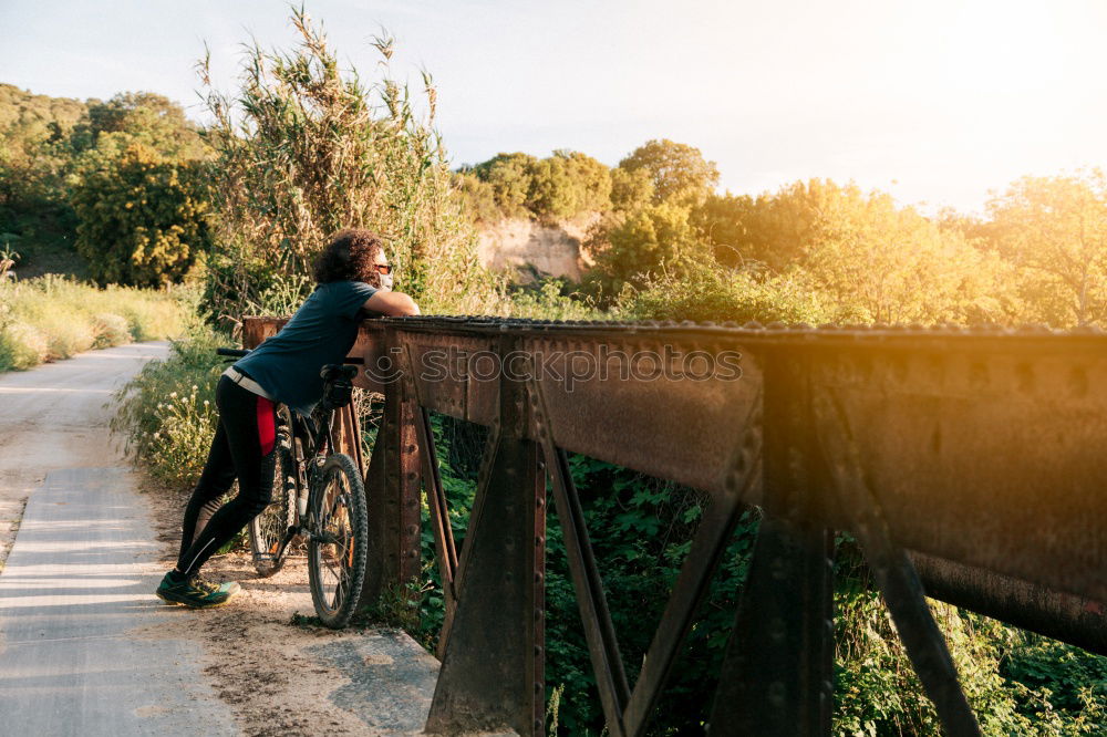 Similar – Cyclist Riding a Bike at sunset. Sports