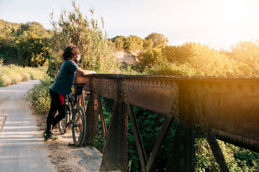 Similar – Cyclist Riding a Bike at sunset. Sports