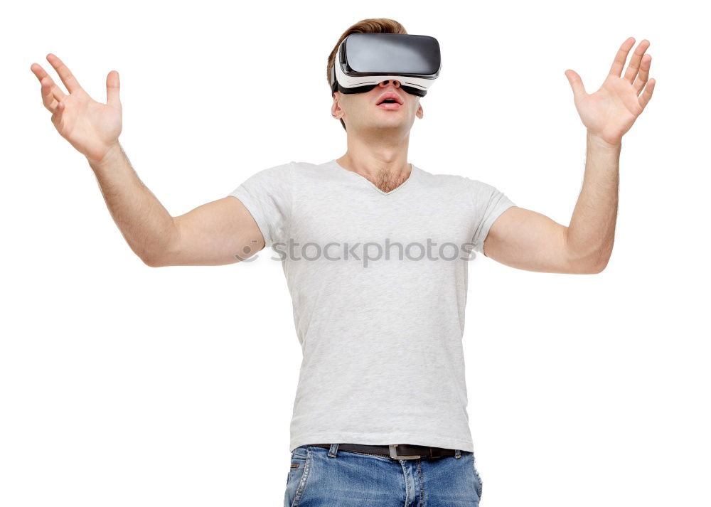 Similar – Man with VR glasses scared and raises hands on white background