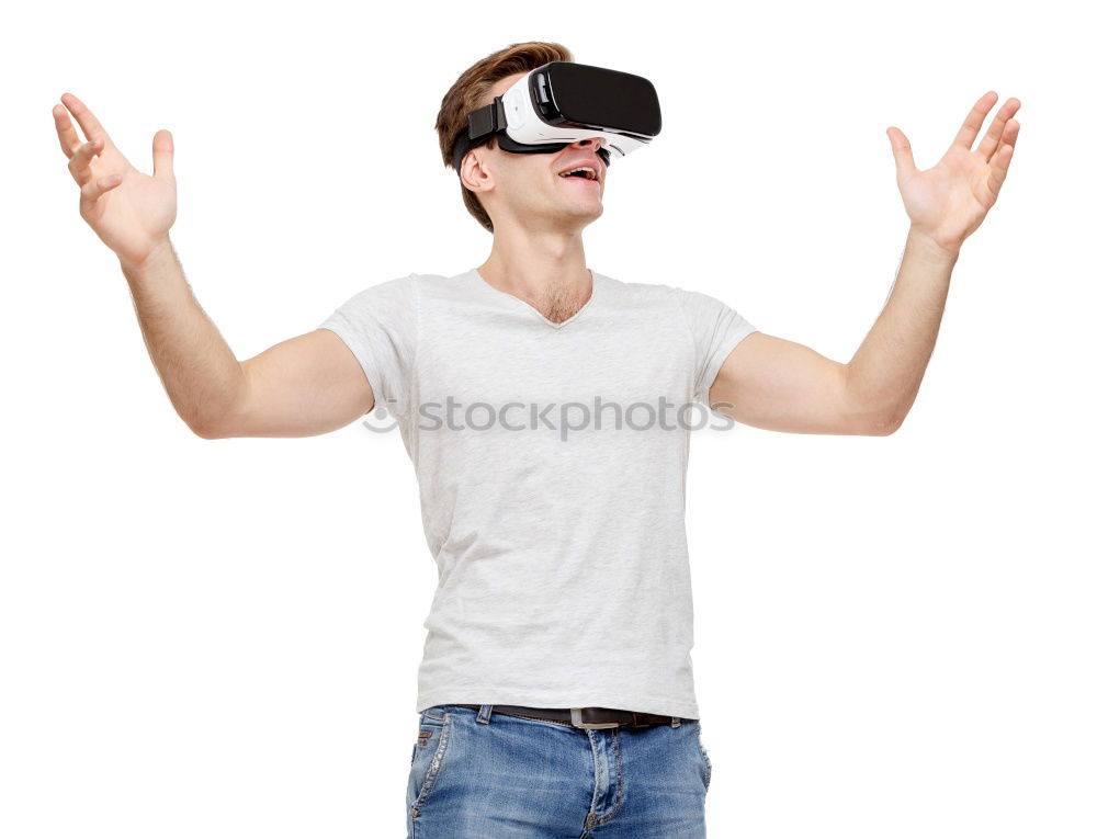 Similar – Man with VR glasses scared and raises hands on white background