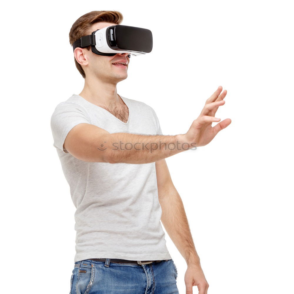 Similar – Man with VR glasses scared and raises hands on white background