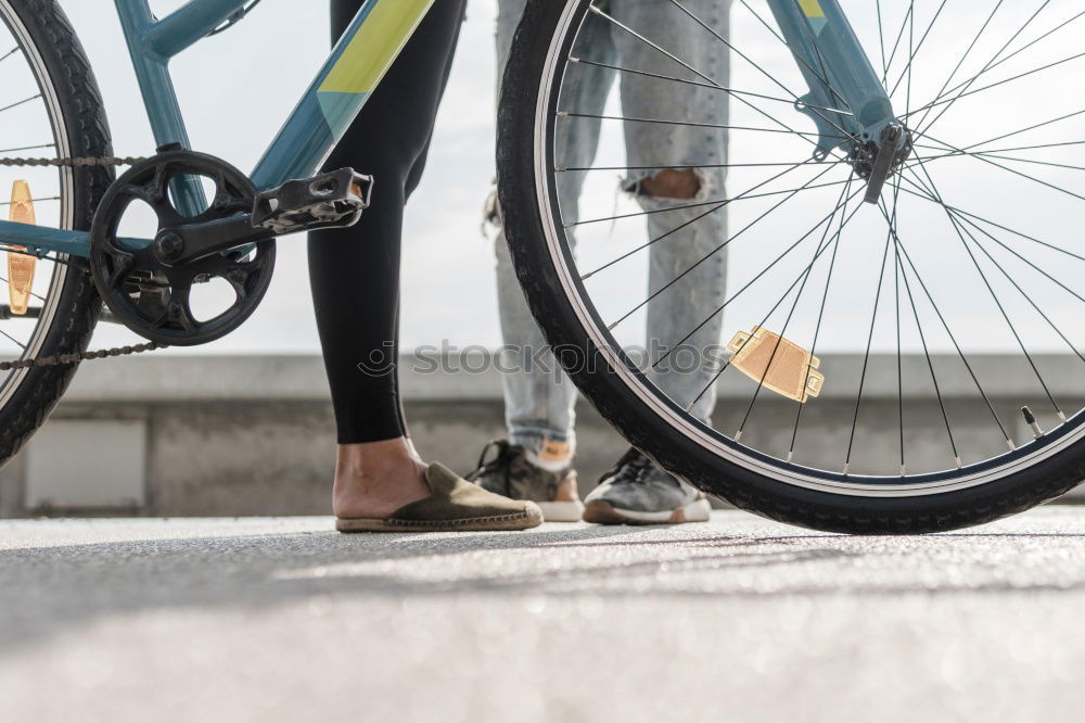 Similar – Mann mit Fahrrad auf Brücke stehend